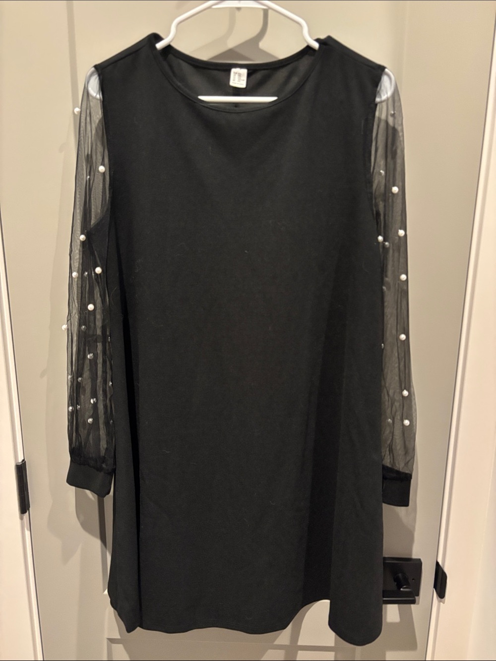Black dress with pearl sleeve detailing